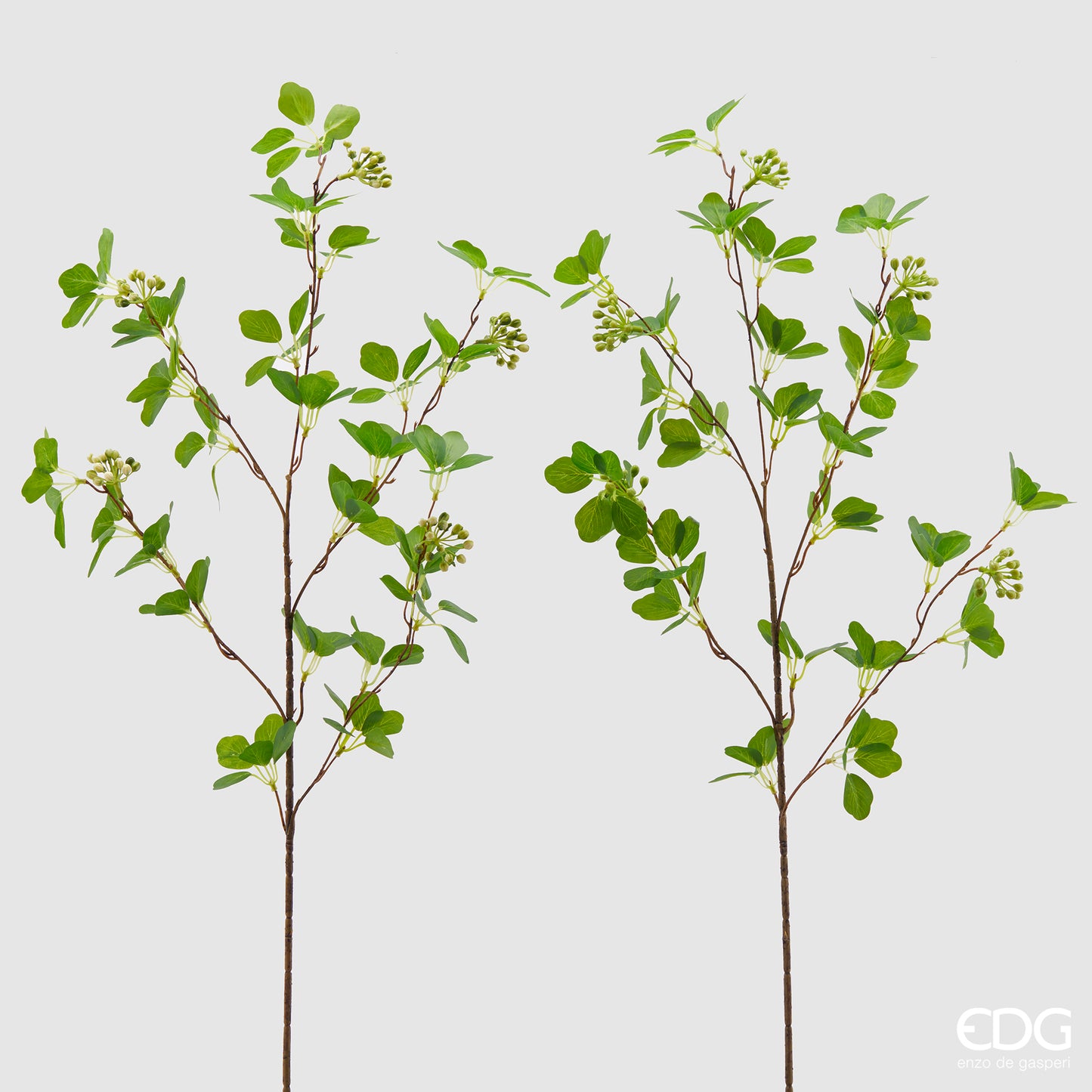 Ramo artificiale di Viburno con foglie e bacche verdi/bianche. Il Viburno è un arbusto sempreverde con portamento eretto molto folto e cespuglioso. Dimensioni: altezza cm 90. In negozio e online su tuttochic.it.