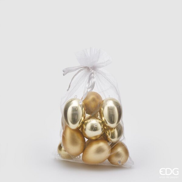 Sacchetto contenente 12 uova in plastica di colore oro, 6 lucide e 6 opache. Dimensioni: h 6 cm. In negozio e online su tuttochic.it