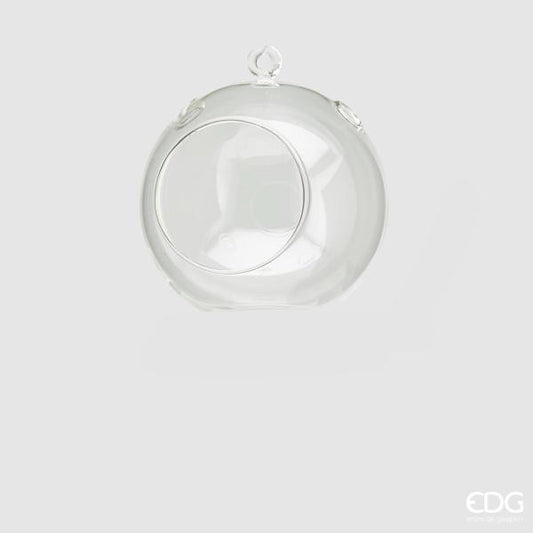 Portacandela sfera da tavolo in vetro trasparente, con asola superiore per poterlo appendere. Dimensioni: ø cm 12. In negozio e online su tuttochic.it
