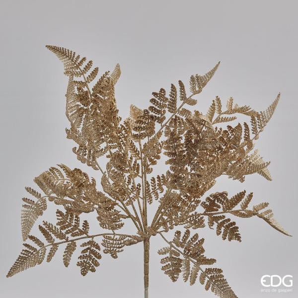 Cespuglio di Felce ornamentale artificiale di colore oro glitter. Dimensioni: cm 46 h. In negozio e online su tuttochic.it