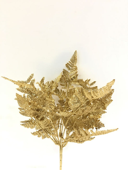 Cespuglio di Felce ornamentale artificiale di colore oro glitter. Dimensioni: cm 46 h. In negozio e online su tuttochic.it