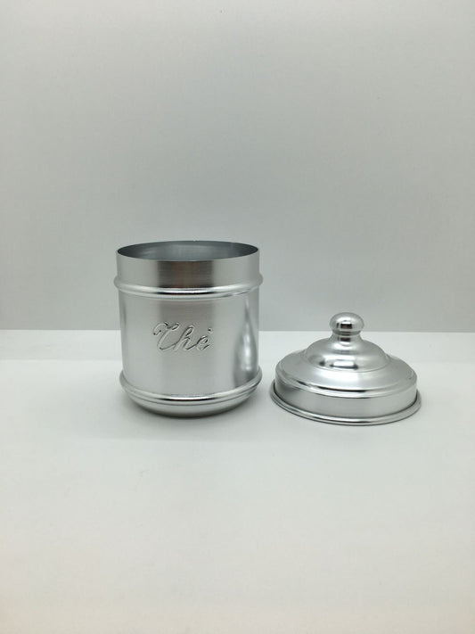 Barattolo in alluminio con scritta thè