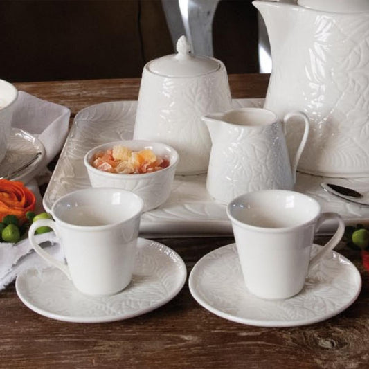 Set di 6 tazzine caffè con piattino in porcellana bianca. Dimensioni con piattino: cm Ø 11; h 6,5 ; 80 cc. Lavabile in lavastoviglie Utilizzabile in microonde Utilizzabile in forno tradizionale. In negozio e online su tuttochic.it