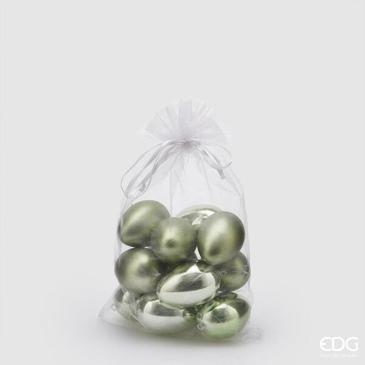 Sacchetto contenente 12 uova in plastica di colore verde, 6 lucide e 6 opache. Dimensioni singolo uovo: h 6 cm. In negozio e online su tuttochic.it