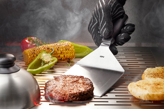 Paletta per barbecue professionale extra-large in acciaio inossidabile con impugnatura ergonomica nera.