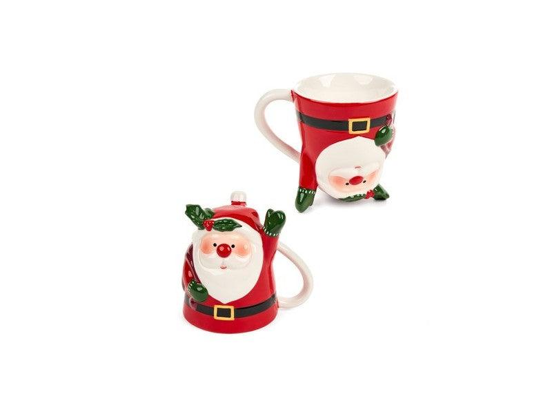 Tazza Babbo Natale della collezione "Cartoline di Natale" di Nuvole di Stoffa. Realizzata in ceramica decorata, questa tazza unica è disponibile in due modelli diversi e poggiata al contrario, si trasforma in un'originale oggetto d'arredo. Capacità 300 ml. In negozio e online su tuttochic.it