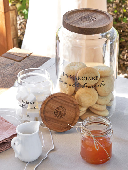 Barattolo per zucchero in vetro borosilicato trasparente decorato con tappo ermetico in legno scuro. cm ø 9 x h 10 - 400 ml. In negozio e online su tuttochic.it
