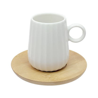 Set di 6 tazzine da caffè INTAVOLA! Realizzate in fine porcellana lavorata con piattino in legno. Capacità: 90 ml Dimensioni: cm Ø 10 x h 8. In negozio e online su tuttochic.it