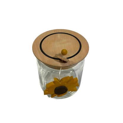 Barattolo ermetico in vetro trasparente con coperchio in legno d'acero e decoro a girasole pendente modello Girasole di Legnomagia.