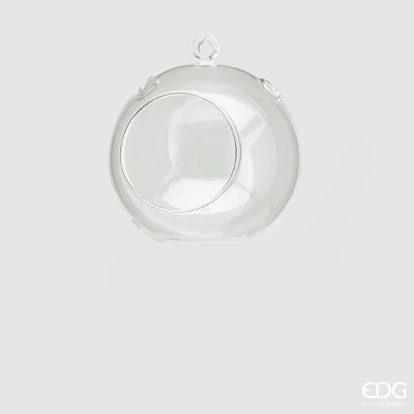 Portacandela sfera da tavolo in vetro trasparente, con asola superiore per poterlo appendere. Dimensioni: ø cm 12. In negozio e online su tuttochic.it