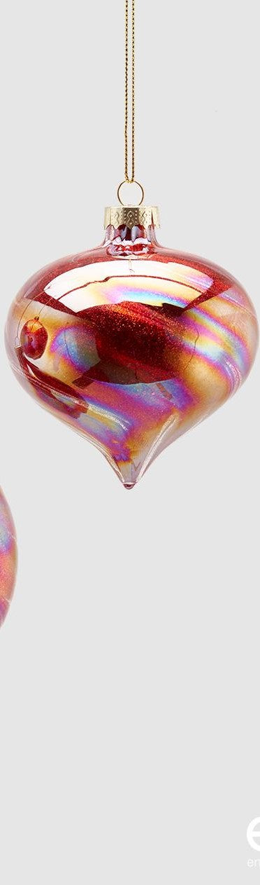 Decoro per albero di Natale, trottola in vetro di colore rosso glitter con effetto iridescente. Dimensioni: cm 8 x 9 h. In negozio e online su tuttochic.it
