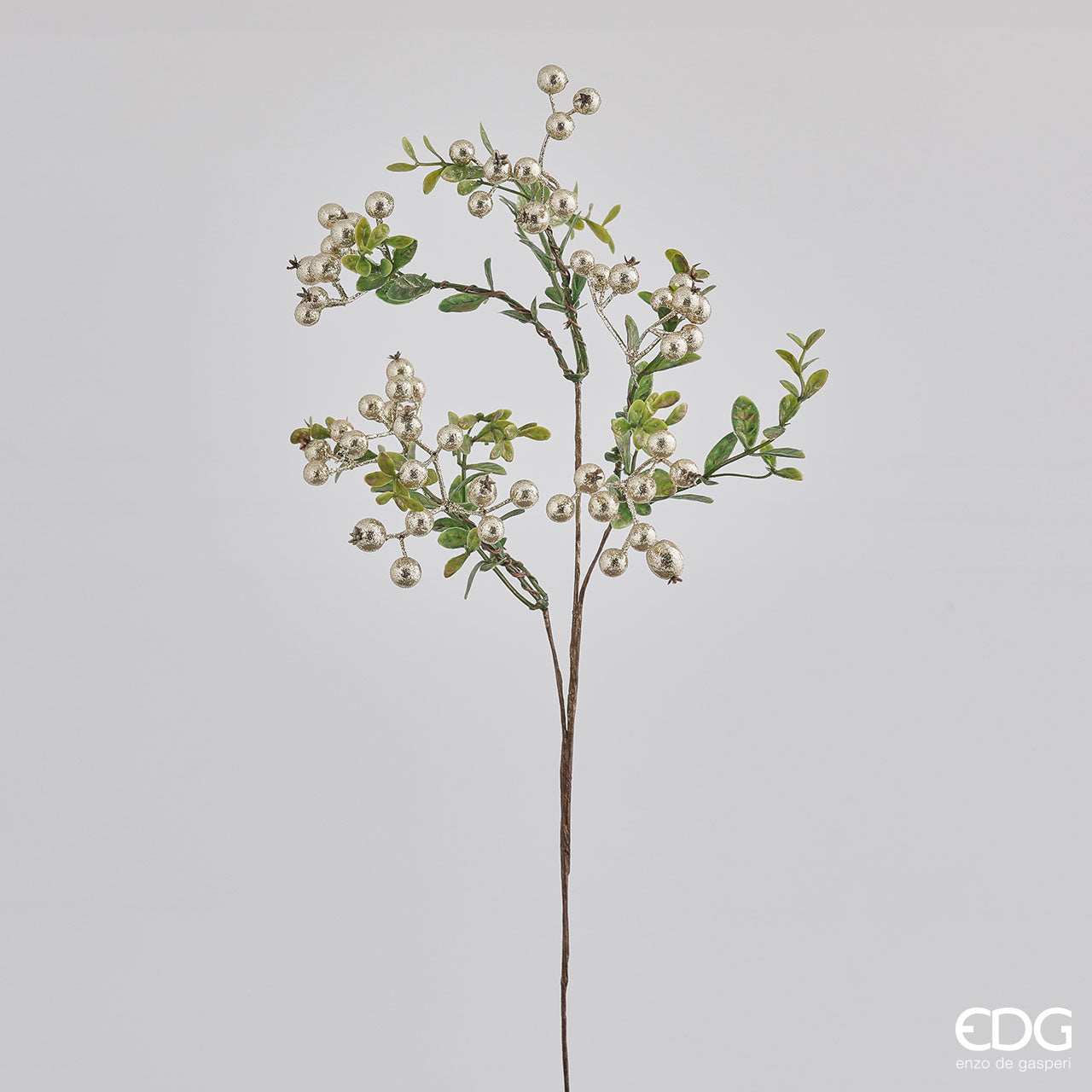 Rametto di Cotoneaster con bacche oro cm 46. Inserito in una composizione di fiori, questo ramo dà volume e un aspetto più raffinato.