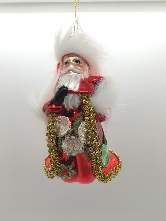 Decoro Babbo Natale in vetro decorato cm. 14 x 8. Il prodotto può essere sia appeso all'albero di Natale che poggiato su un piano.